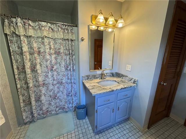 full bathroom with tile patterned floors, baseboards, vanity, and a shower with shower curtain