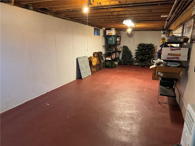 unfinished basement featuring visible vents