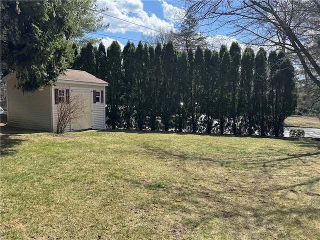 view of yard with an outdoor structure and a shed