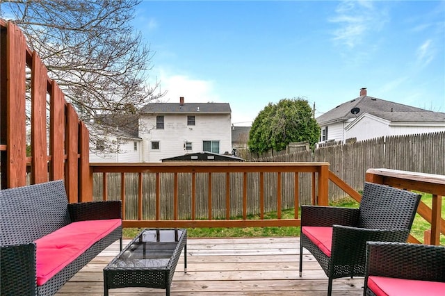 deck with a fenced backyard