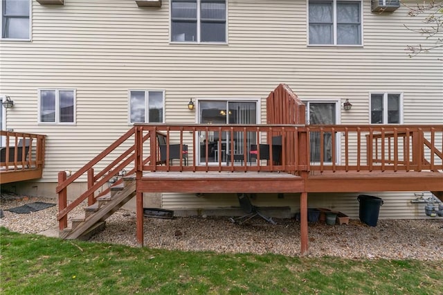 back of property with a wooden deck
