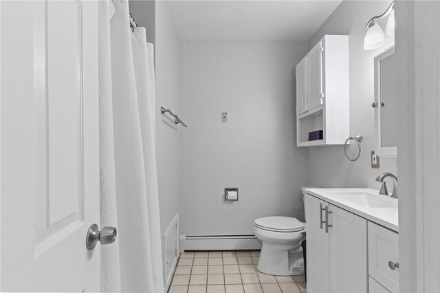 full bath with a baseboard heating unit, toilet, tile patterned flooring, and vanity