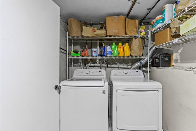 washroom with separate washer and dryer and laundry area