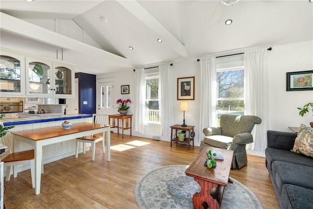 living room with recessed lighting, a ceiling fan, and light wood-type flooring