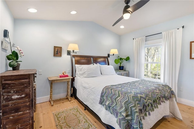 bedroom featuring baseboards, recessed lighting, lofted ceiling, wood finished floors, and ceiling fan
