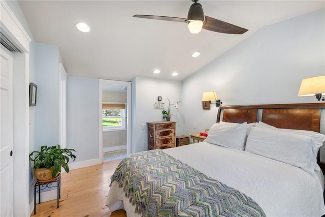 bedroom featuring recessed lighting, light wood-style flooring, lofted ceiling, and baseboards