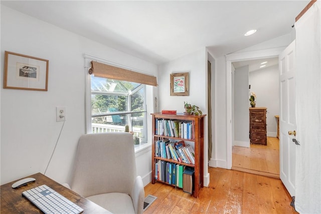 living area featuring recessed lighting, light wood-style flooring, visible vents, and baseboards