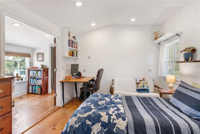 bedroom featuring baseboards, recessed lighting, vaulted ceiling, and light wood-type flooring