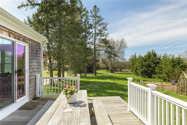 wooden deck with a lawn
