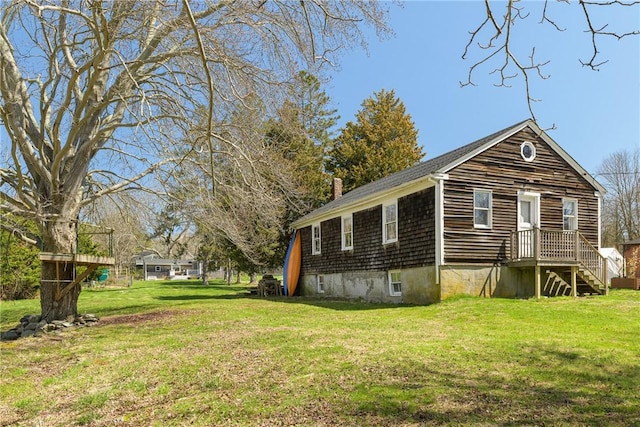 exterior space featuring a lawn and a chimney