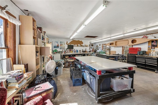 miscellaneous room with a workshop area