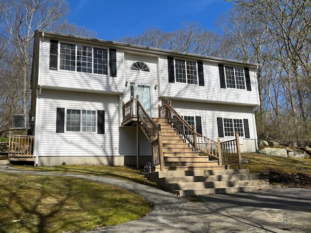 raised ranch featuring stairway and central AC
