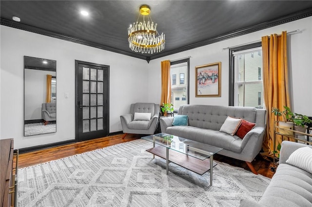 134 Courtland St, Providence, RI 02909 - living room featuring wood finished floors, ornamental molding, and a chandelier
