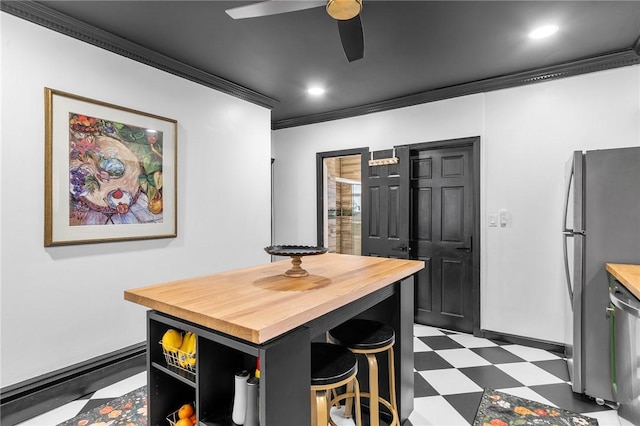134 Courtland St, Providence, RI 02909 - dining space with dark flooring, crown molding, a ceiling fan, recessed lighting, and baseboards