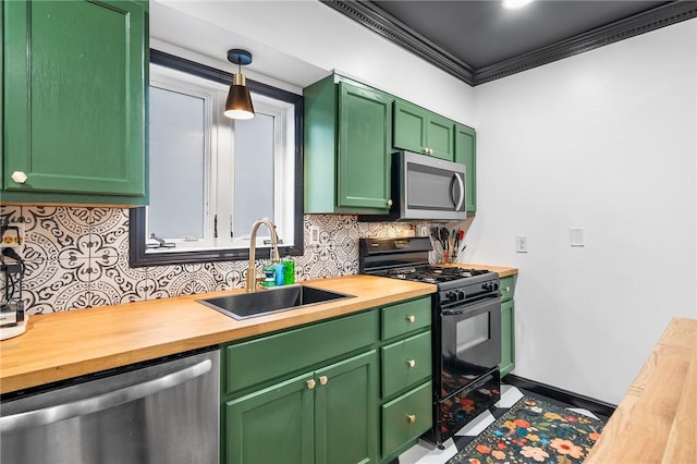 134 Courtland St, Providence, RI 02909 - kitchen with stainless steel appliances, wood counters, a sink, ornamental molding, and tasteful backsplash
