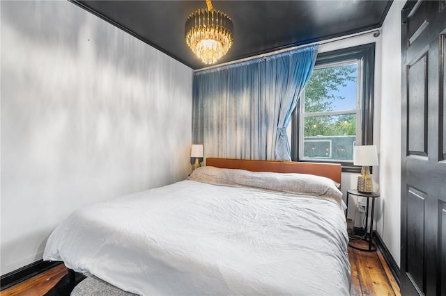 134 Courtland St, Providence, RI 02909 - bedroom featuring wood finished floors, baseboards, and a chandelier