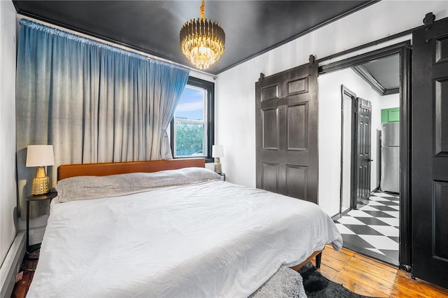 134 Courtland St, Providence, RI 02909 - bedroom featuring wood-type flooring, a chandelier, freestanding refrigerator, and a barn door