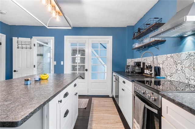 134 Courtland St, Providence, RI 02909 - kitchen featuring wall chimney exhaust hood, electric stove, dark countertops, and dark wood-type flooring