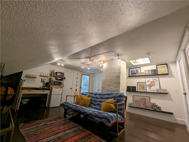 134 Courtland St, Providence, RI 02909 - living room with a textured ceiling, wood finished floors, vaulted ceiling, and baseboards