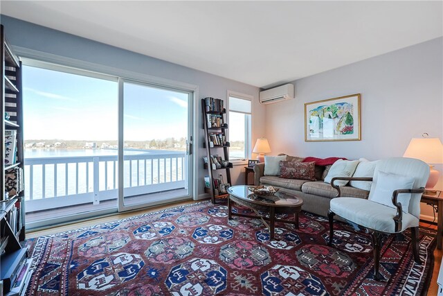 183 Twin Peninsula Ave, South Kingstown, RI 02879 - living area with a wall mounted air conditioner and a water view
