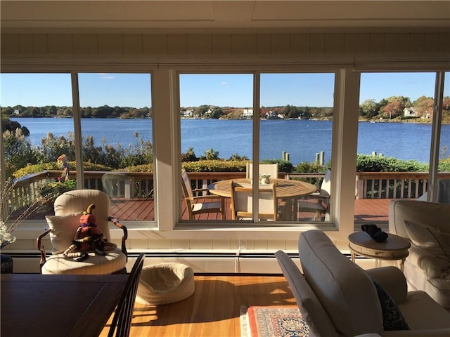 183 Twin Peninsula Ave, South Kingstown, RI 02879 - sunroom with wood finished floors, healthy amount of natural light, and a deck with water view