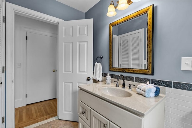 bathroom featuring a wainscoted wall, vanity, and tile patterned floors