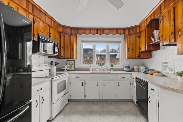 kitchen with a sink, tasteful backsplash, ceiling fan, light countertops, and black appliances