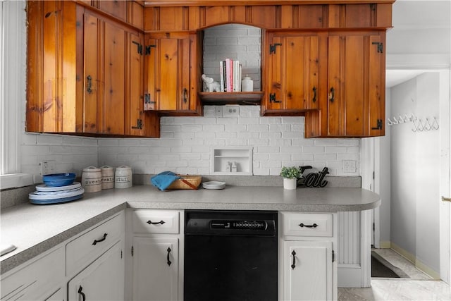 kitchen with dishwasher, backsplash, white cabinetry, and light countertops