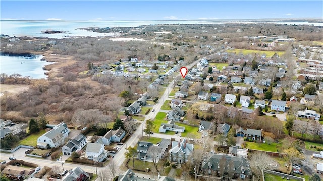 birds eye view of property with a water view and a residential view