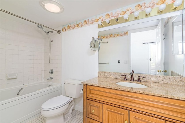 bathroom featuring toilet, vanity, bathtub / shower combination, and tile patterned floors