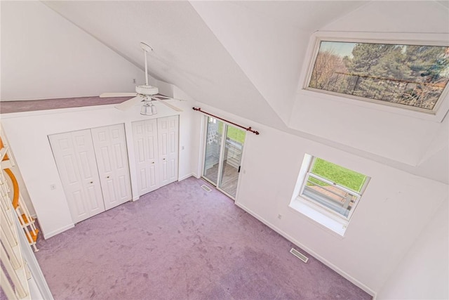 bonus room with carpet floors, lofted ceiling, a ceiling fan, and visible vents