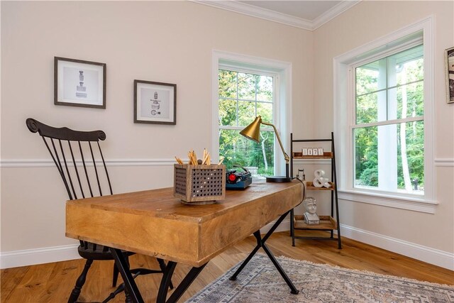 home office with baseboards, ornamental molding, and wood finished floors