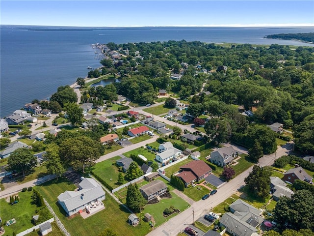 drone / aerial view with a water view and a residential view