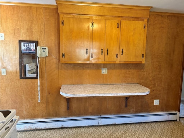 interior details with wood walls and white electric range