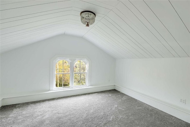 additional living space with lofted ceiling and carpet