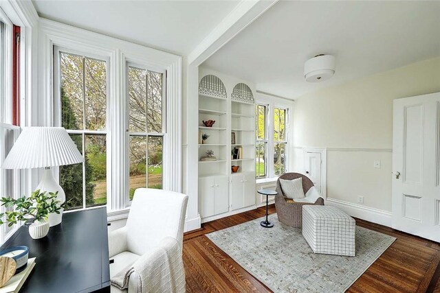 sitting room featuring dark wood finished floors