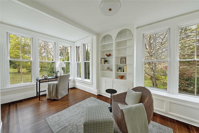 sunroom / solarium with wood finished floors and a healthy amount of sunlight