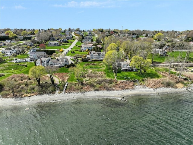 birds eye view of property with a residential view and a water view