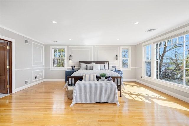 bedroom featuring visible vents and multiple windows