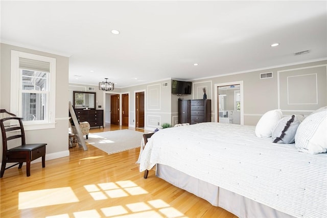 bedroom featuring a chandelier, light wood-type flooring, visible vents, and recessed lighting