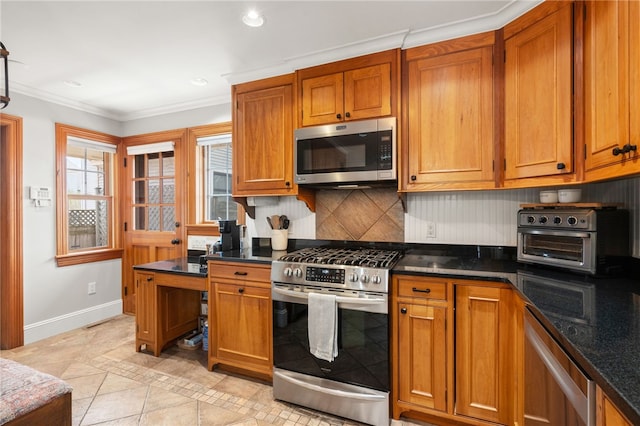 kitchen featuring brown cabinets, decorative backsplash, and appliances with stainless steel finishes