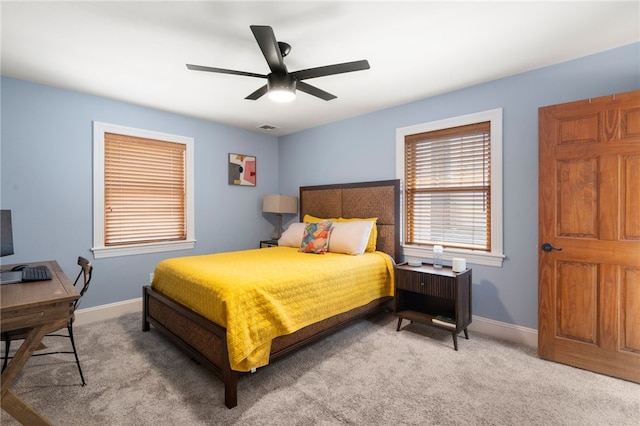 bedroom with carpet, visible vents, baseboards, and ceiling fan