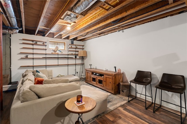 living area featuring visible vents and dark wood-style floors
