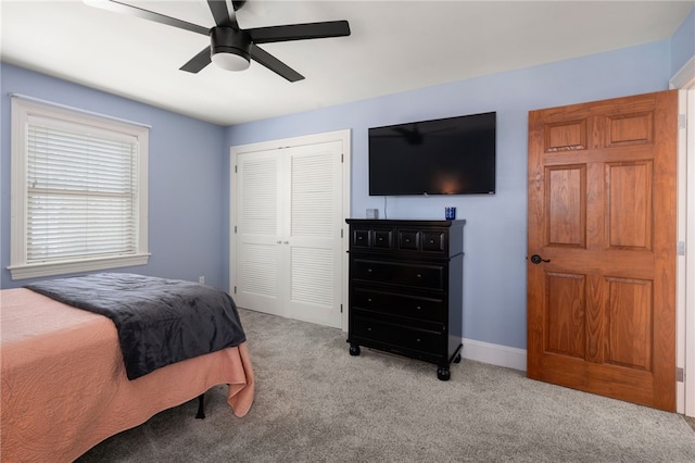 bedroom featuring carpet, a closet, and ceiling fan