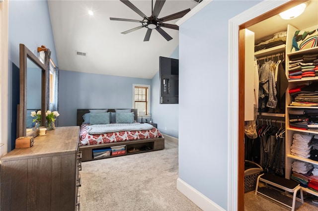 carpeted bedroom featuring high vaulted ceiling, baseboards, visible vents, and a closet