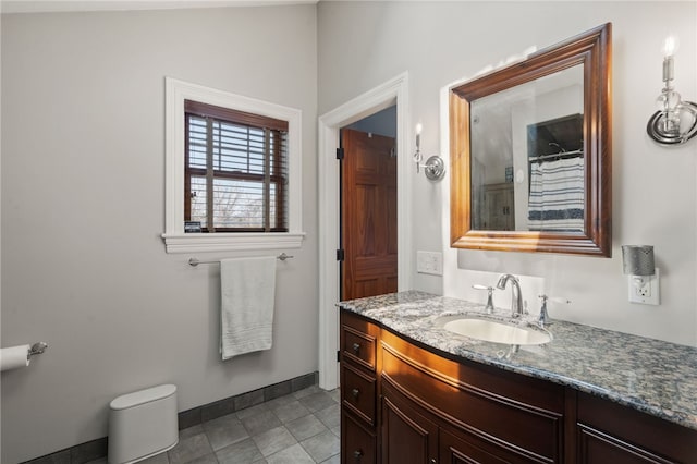 bathroom featuring tile patterned flooring, baseboards, vanity, and a shower with shower curtain