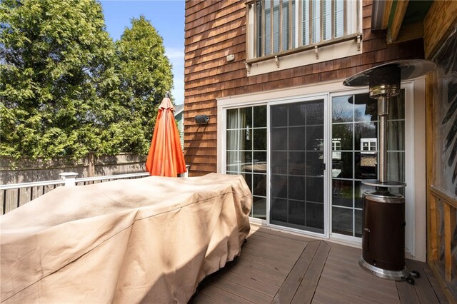 exterior space with wood finished floors and wood walls