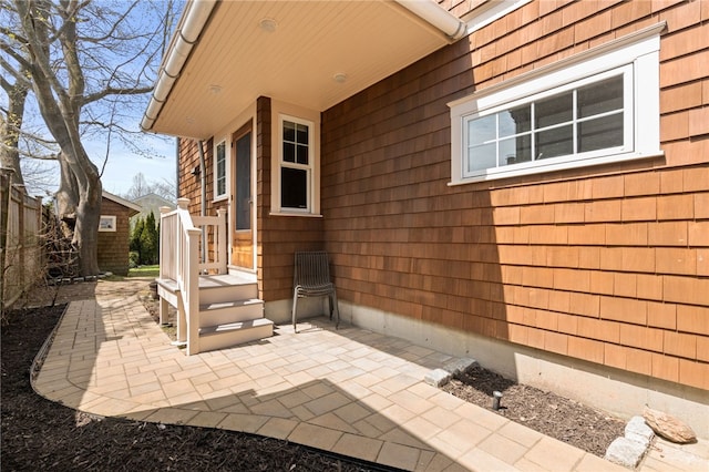 view of home's exterior featuring fence and a patio area