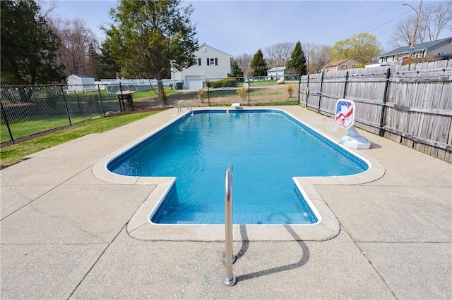 view of swimming pool with fence, a patio, and a fenced in pool