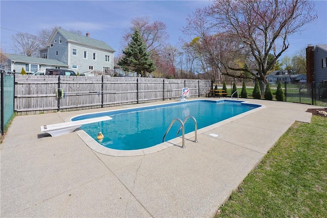 view of swimming pool featuring a patio area, a fenced in pool, and a fenced backyard